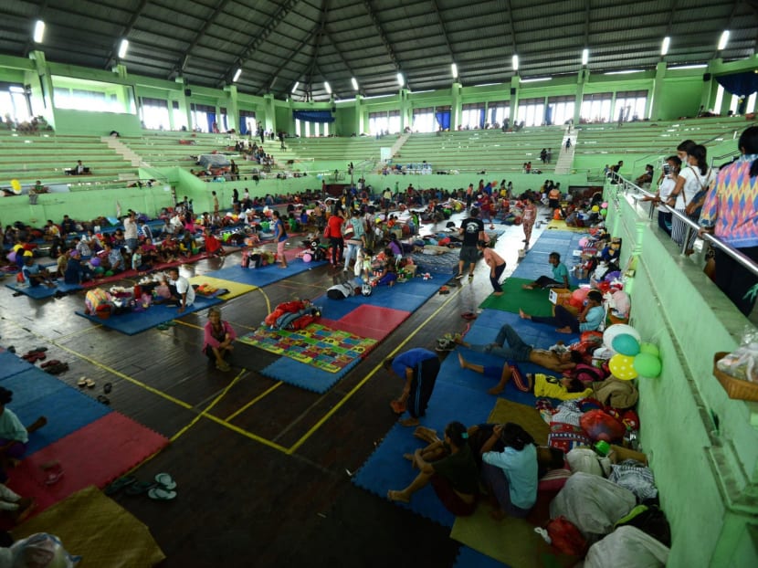 People at an evacuation centre in Bali. The authorities have raised volcano alert levels after small tremors stoked fears Mount Agung could erupt for the first time in more than 50 years. Photo: AFP