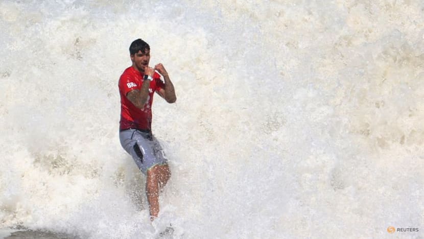 Surfing-Brazil's Medina overcomes Toledo, shark scare to win third world title