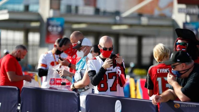 Mask-clad fans stream into Buccaneers' home stadium for Super Bowl unlike any other Mask-clad fans stream into Buccaneers' home stadium for Super Bowl unlike any other