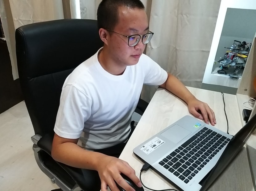 Recruit Ferguson Chiew, 18, doing home-based learning for his Basic Military Training at his home in Tampines.