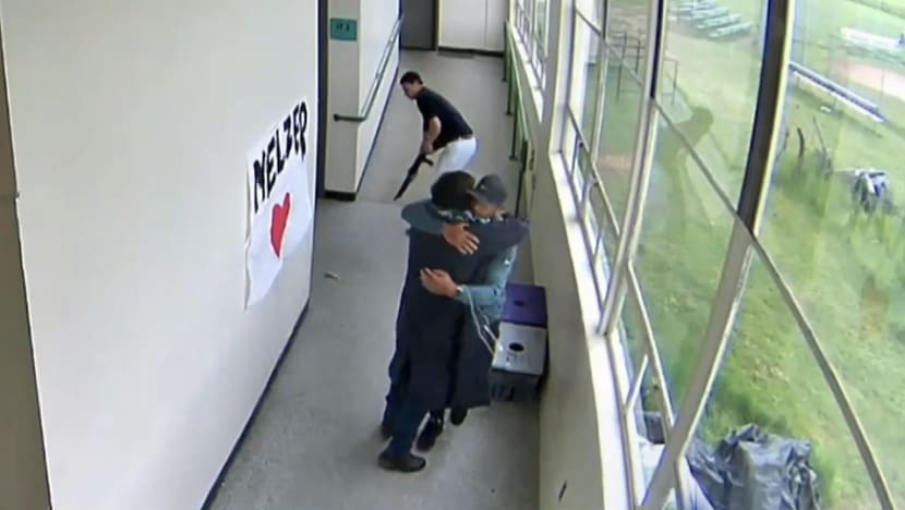 Video emerges of coach disarming, hugging gun-wielding student in US school