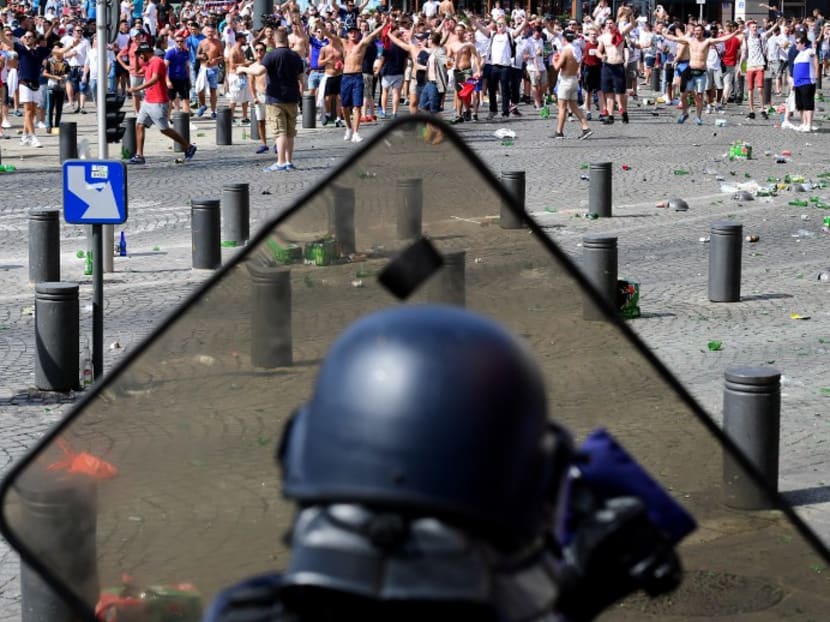 England fans clash with police personnel as England fans gather in the city of Marseille, southern France, on June 11, 2016, ahead of the Euro 2016 football match between England and Russia. PHOTO: AFP
