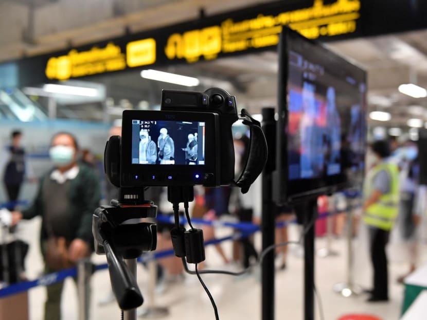Images are seen on thermographic devices checking the temperatures of arrival passengers at the Bangkok's Suvarnabhumi International airport in Thailand.