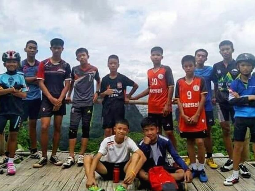 Photo of the day: The 12 members of the Wild Boar soccer team and their coach, who were all successfully rescued from a flooded cave in Chiang Rai, pose for a group photo in this undated photograph. Photo: Social media