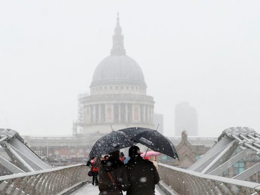 The heaviest snowfall in four years in Britain caused travel mayhem Sunday (Dec 10), while more than 300 flights were cancelled at Germany’s busiest airport and a ferry ran aground in the French port of Calais. Photo: AFP