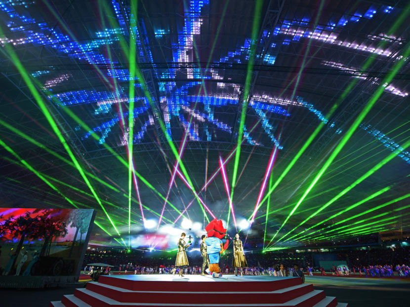 Laser lights fill the stadium during the closing ceremony of the SEA Games in Singapore. Photo: AP