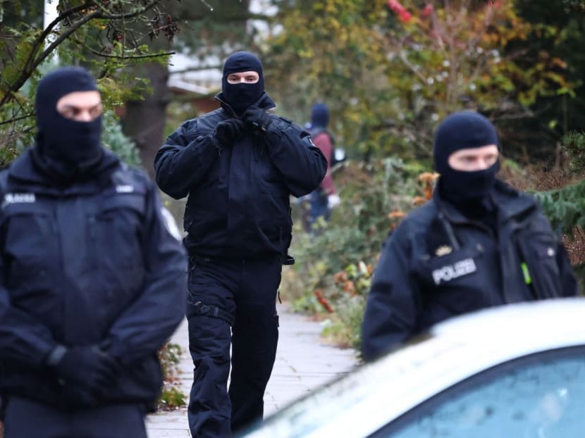 Police secures the area after 25 suspected members and supporters of a far-right group were detained during raids across Germany, in Berlin, Germany on Dec 7, 2022. 
