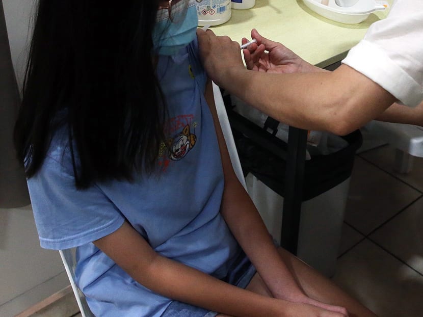 A child in Singapore getting vaccinated against Covid-19 in 2021.
