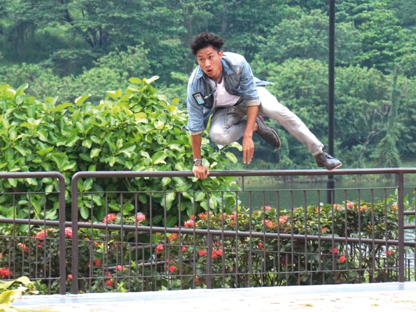 Desmond Tan eventually conquering
that fence. 
Photo: Hon Jing Yi
