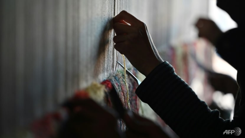 Afghan families go back to making carpets as economy unravels Afghan families go back to making carpets as economy unravels
