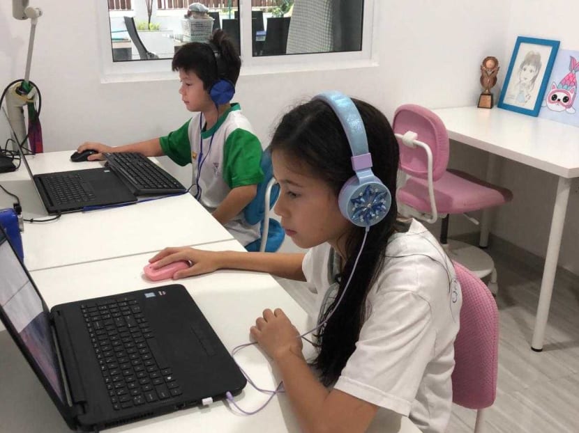 Ms Iris Sim-Glasscoe's children Cameron James Glasscoe, 7 (left), a Primary 1 student at Catholic High School and Summer Rose Glasscoe, 10 (right) a Pri 4 student in St Nicholas Girls’ School. They are pictured taking part in home-based learning.