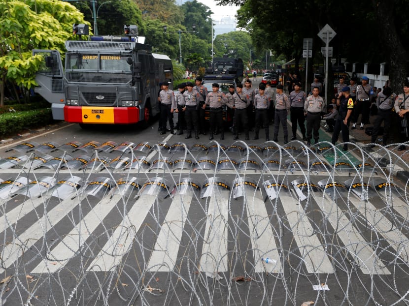 Photo of the day: Police officers stand guard outside the General Election Commission headquarters in Jakarta, Indonesia, following the announcement of last month's presidential election results on May 21, 2019.