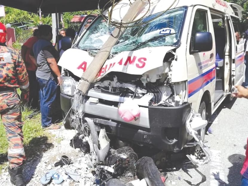 The wrecked ambulance that collided with a motorcycle ridden by the 12-year-old sister of Ahmad Hazim Ahmad Nazir, who died in the crash.
Photo: Perak Fire and Rescue Department