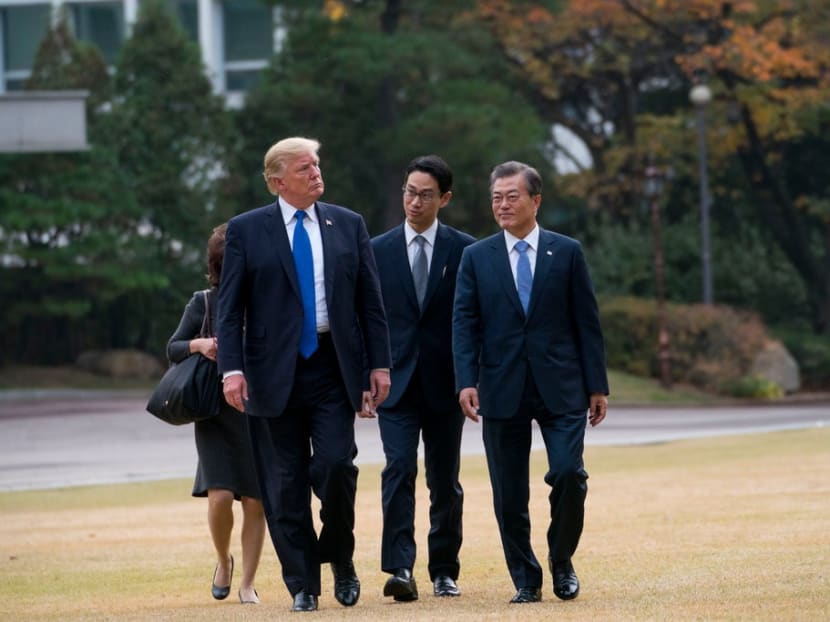 Mr Donald Trump with President Moon Jae-in, who supported the drill suspension to encourage North Korea to move forward on nuclear arms talks.