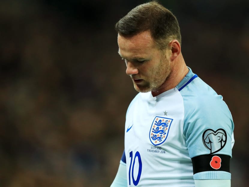 Wayne Rooney has apologised for his behaviour after "inappropriate" photos of him were shared online. Photo: Getty