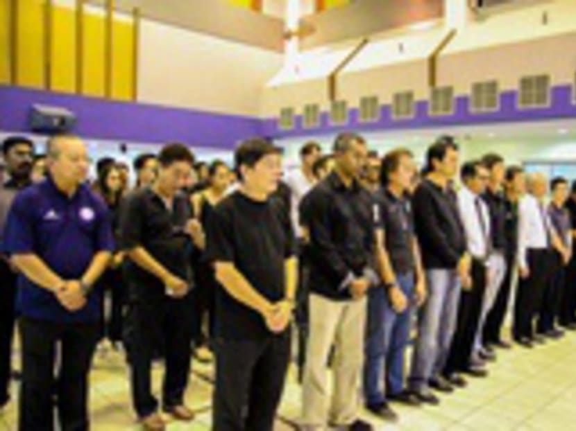 FAS president Zainudin Nordin and the football community paying tribute to Mr Lee Kuan Yew at Toa Payoh Central Community Club yesterday. Photo: FAS