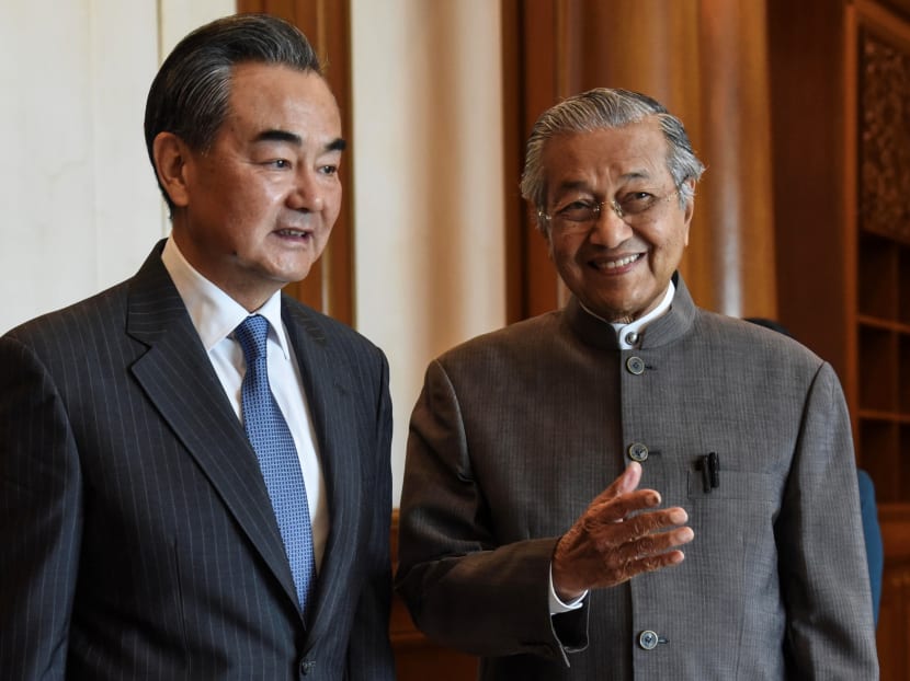 Prime Minister Mahathir Mohamad with Chinese Foreign Minister Wang Yi.
