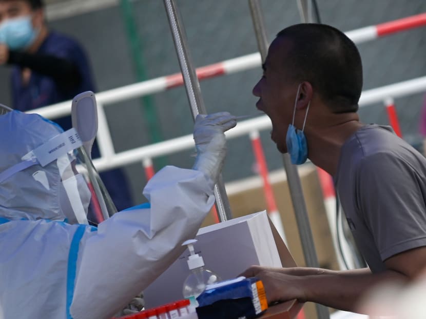 A man receives a swab test during widespread testing for Covid-19 in Beijing on July 1, 2020.