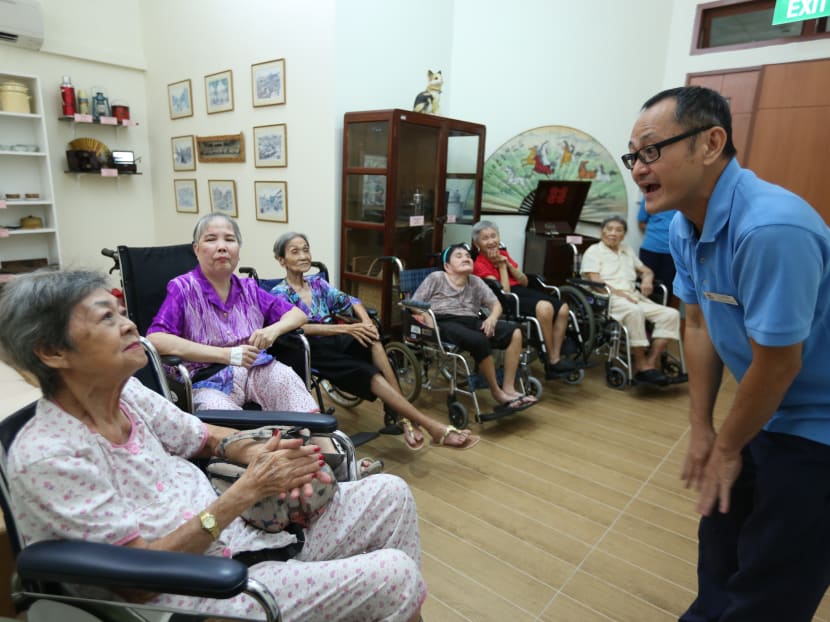 Residents of the Ling Kwang Home for Senior Citizens in cheerful spirits during reminiscence therapy sessions. The home has a dedicated room where reminiscence therapy can be specially conducted. Photo: Toh Ee Ming/TODAY