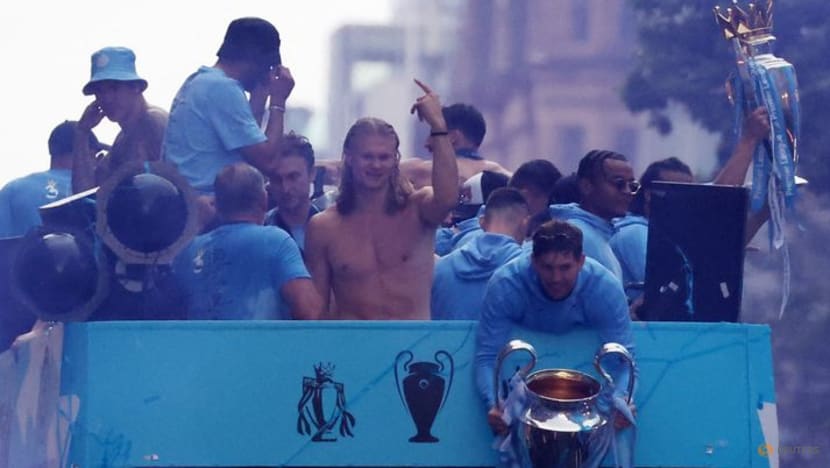Manchester City dance in the rain to celebrate treble 