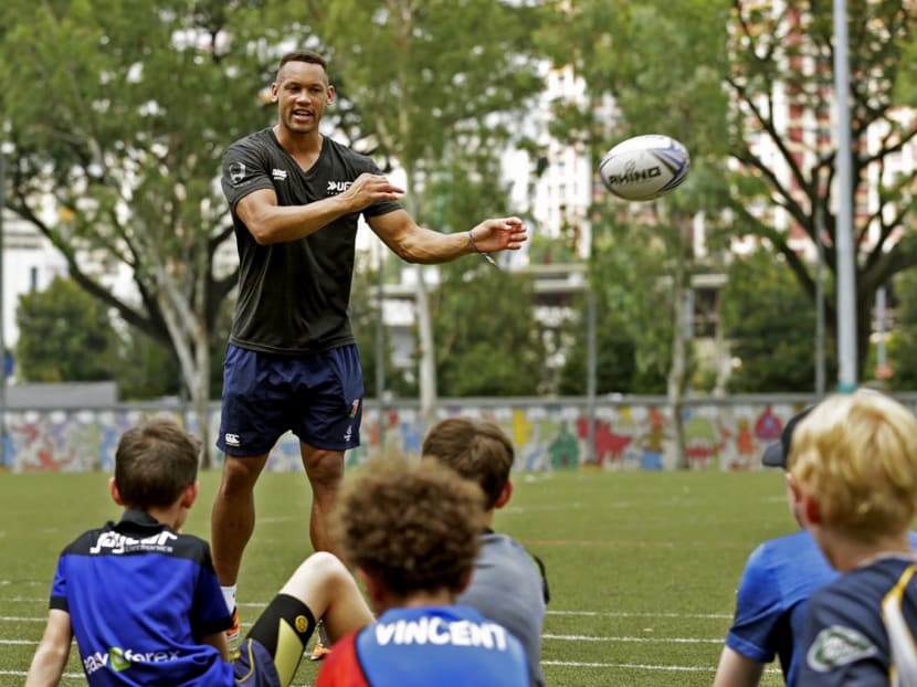 Norton conducting a rugby clinic for students at the Australian International School yesterday. He believes the sevens game helps to build up young kids for all levels of rugby. Photo: Wee Teck Hian
