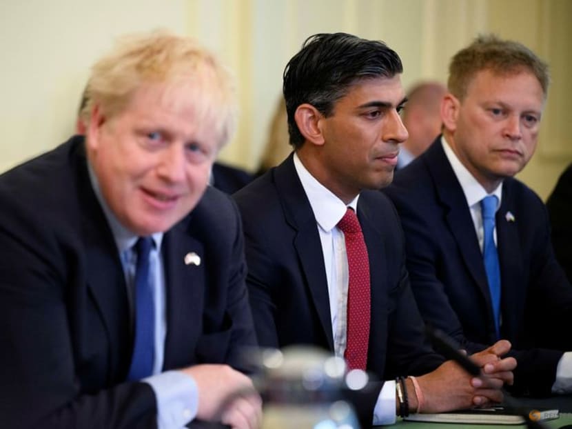 A file photo of Mr Boris Johnson addressing his cabinet in Downing Street on June 7, 2022, as Mr Rishi Sunak listens on.