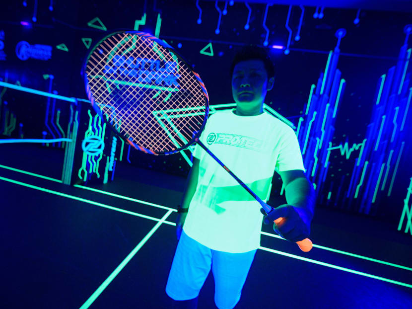 A badminton player shows his glow-in-the-dark badminton racket at a badminton court in Kuala Lumpur, Malaysia on March 24, 2022. A badminton player shows his glow-in-the-dark badminton racket at a badminton court in Kuala Lumpur, Malaysia on March 24, 2022.