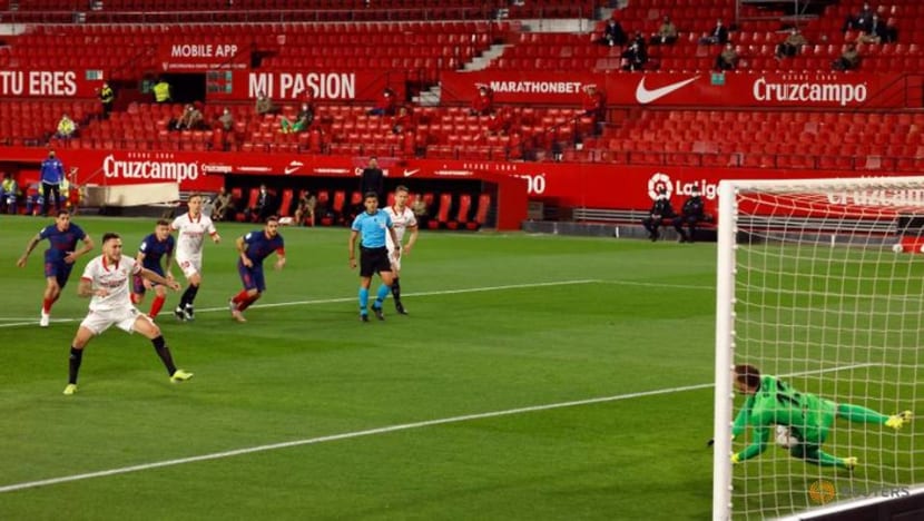 Football: Atletico's title bid falters again with loss at Sevilla Football: Atletico's title bid falters again with loss at Sevilla