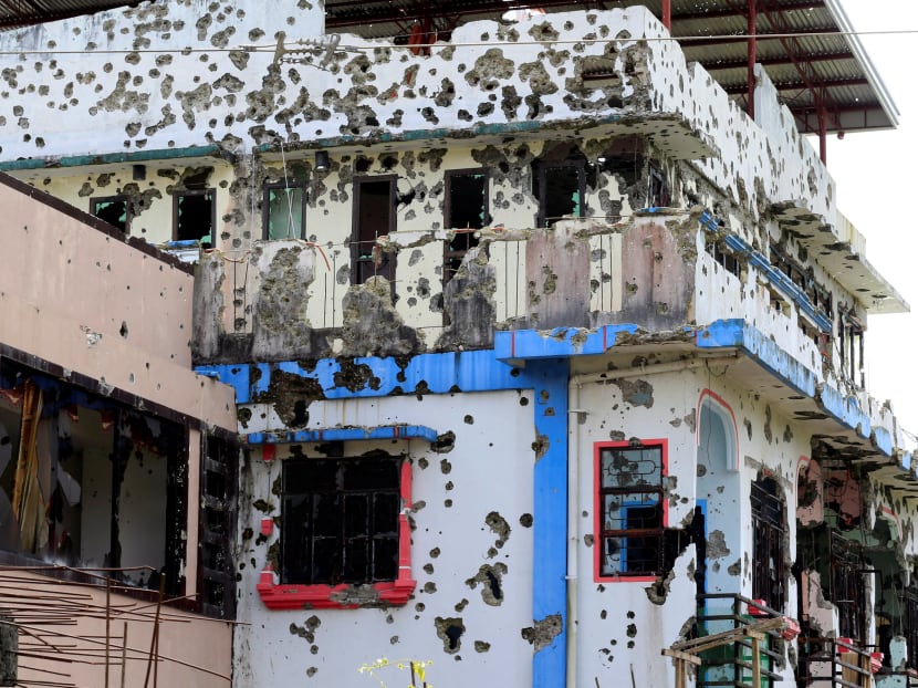A bullet-riddled apartment is seen in Marawi city, Philippines. Malaysia's intelligence personnel are concerned about the return of Malaysian militants from Raqqa, Iraq and Marawi, where the Islamic State (IS) have been routed. Photo: Reuters