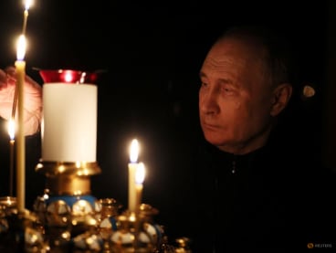 Russian President Vladimir Putin lights a candle in memory of the victims of the Crocus City Hall attack, on the day of national mourning in a church at the Novo-Ogaryovo state residence outside Moscow, Russia on March 24, 2024.