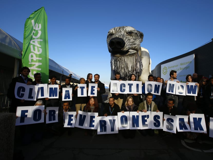 Activists from Greenpeace stage a protest in front of a two-story-high, mechanically operated polar bear called Aurora into the conference venue, to represent everyone hoping in the next 72 hours during the COP21, United Nations Climate Change Conference in Le Bourget, north of Paris, France,  Wednesday, Dec. 9, 2015. Photo: AP