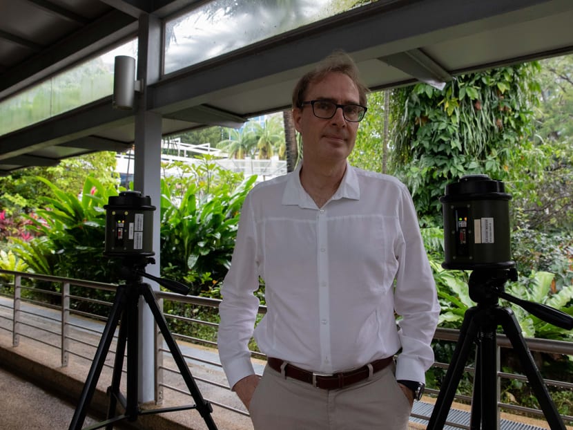 Professor Stephan Schuster posing with an air sampling machine at the Singapore Centre for Environmental Life Sciences Engineering located at the Nanyang Technological University.