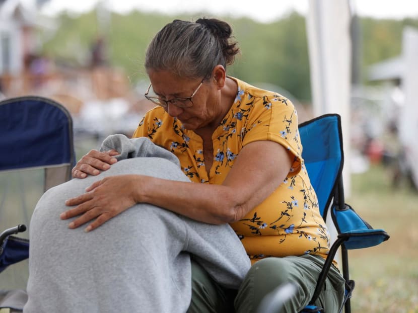 Ms Annie Sanderson comforts her granddaughter, who was close with Gloria Lydia Burns, 62, who was killed on James Smith Cree Nation after a stabbing spree killed 10 people on the reserve and nearby town of Weldon, Saskatchewan, Canada on Sept 5, 2022. 
