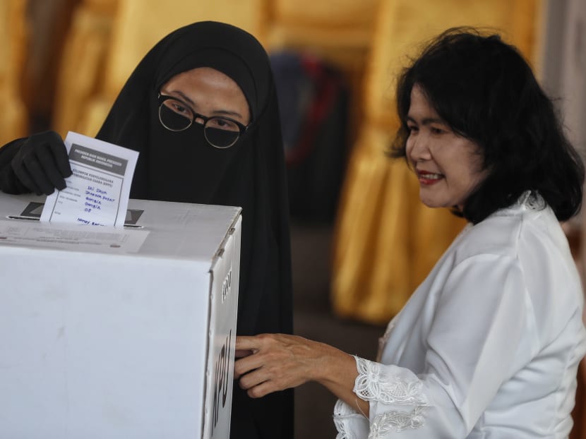 A veiled voter casting her vote in Jakarta on Wednesday, April 17, 2019. Growing conservatism, coupled with the rise of identity politics, has led to greater polarisation in Indonesia than ever, analysts said.