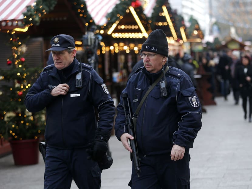 Police patrol among people at the re-opened Christmas market at Breitscheid square in Berlin, Germany, Dec 22, 2016. Photo: Reuters