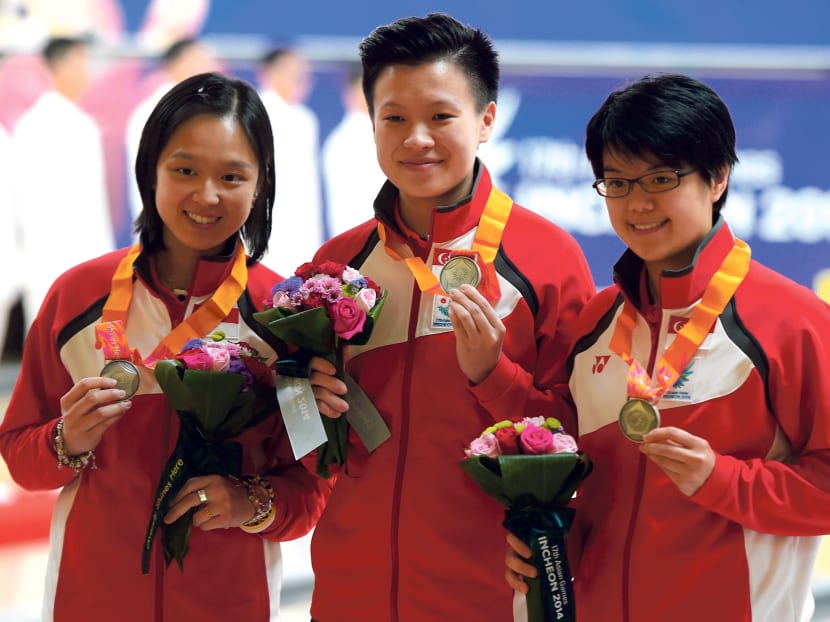 Not satisfied with just silver, Jazreel Tan (from left), New Hui Fen and Cherie Tan will now concentrate on winning gold in the team event. Photo: AFP