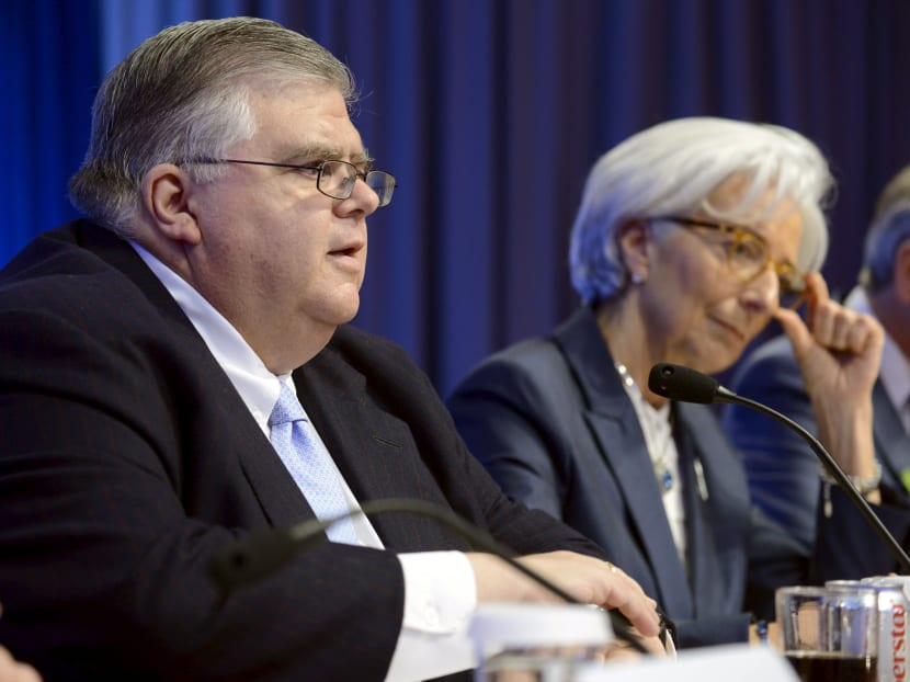 Bank of Mexico Governor Agustin Carstens (left) makes remarks as International Monetary Fund Managing Director Christine Lagarde listens during a news conference at the conclusion of the International Monetary and Financial Committee (IMFC) Plenary Session. Photo: Reuters
