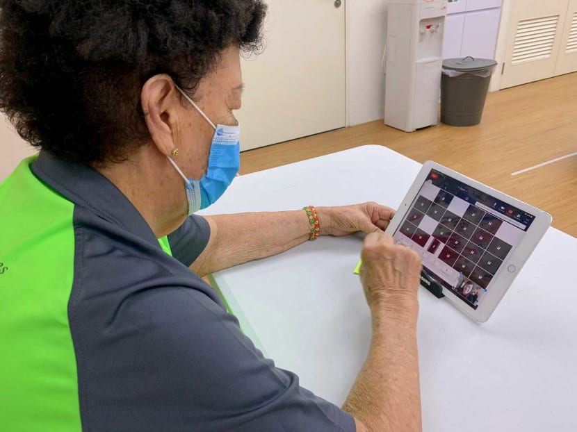 Elders get to chat and do online activities with DBS bank volunteers through video calls at senior activity centres run by Lions Befrienders.
