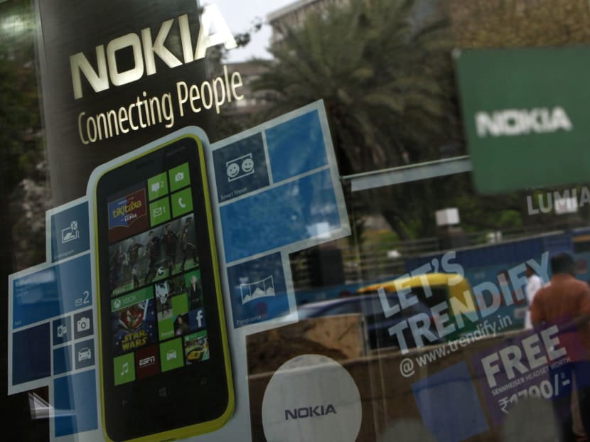 Nokia today announced new low-cost candybar phones that have 3G and lets users get Facebook and Twitter updates. Photo REUTERS