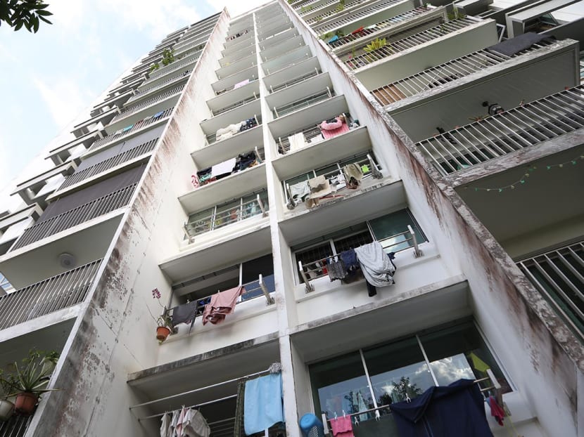 Clothes hung out of windows to dry at a housing block along Anchorvale Crescent.