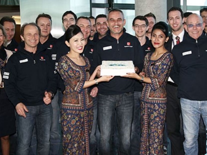 Singapore Airlines stewardesses pose at a ceremony announcing the sponsorship. Photo: Sauber F1 website