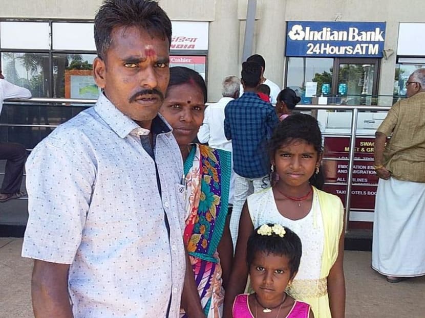 Alagu Periyakarrupan (left) with his wife A Panjali and their two younger daughters Ranjini, 11, and Rekha, six.