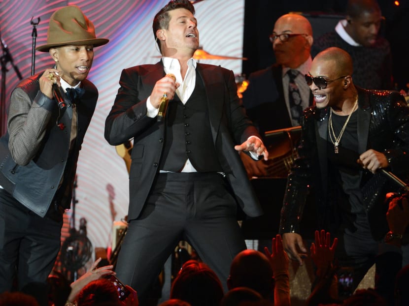 Pharrell Williams (L), Robin Thicke and T.I. perform at the Clive Davis Pre-Grammy Gala and Salute to Industry Icons, honoring Universal Music Group Chairman and CEO Lucian Grainge, in Beverly Hills, California in this January 25, 2014 file photo. Photo: Reuters