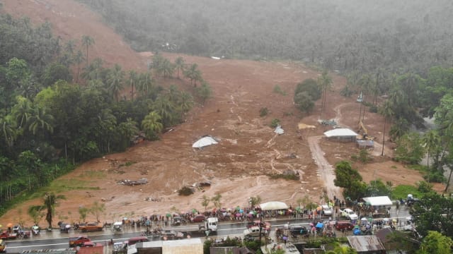 台风引发洪灾土崩 菲律宾至少67人亡