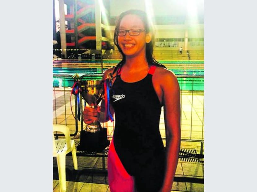 Tan Jing-E with her Most Valuable Player award after setting three national U-14 records at the 45th Singapore National Age-Group Championships. Photo: Adelene Wong