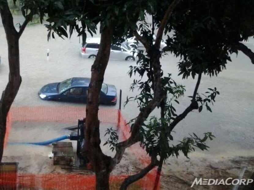 Flash floods at the junction of Chai Chee Rd and New Upper Changi Rd at about 1pm on Wednesday (Oct 30). Photo: YourNews contribution by Faisal Suptu