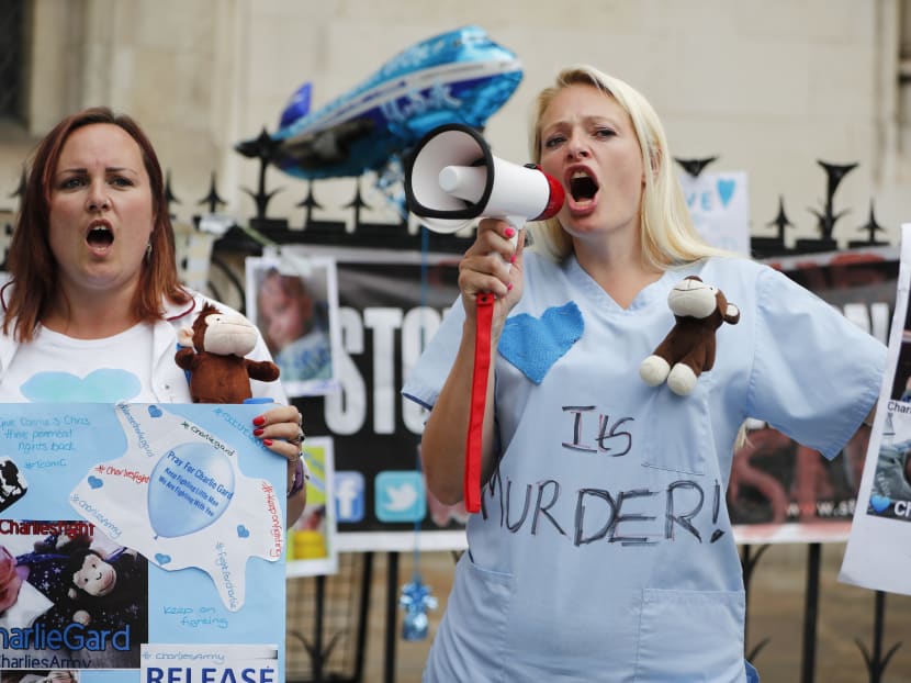 People gathering outside the High Court in support of continued medical treatment for critically-ill 11-month old Charlie Gard who is due to be taken off life support, in central London on July 13, 2017. Photo: AFP