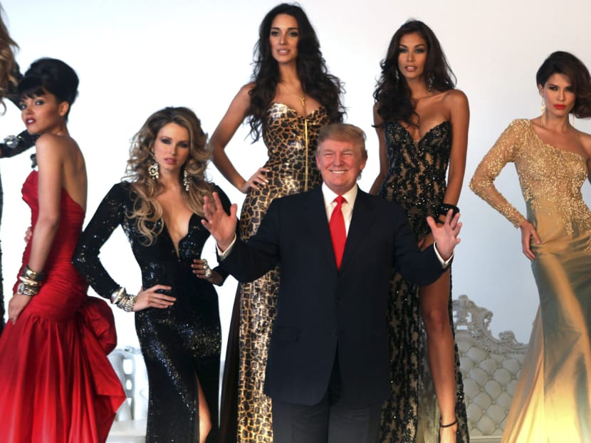 Property investor Donald Trump (C) poses with former Miss Universe Beauty Queens (L-R) Susie Castillo of the U.S., Shandi Finnessey of the U.S., Amelia Vega of the Dominican Republic, Dayana Mendoza of Venezuela, and Justine Pasek of Panama during a pageant photo shoot in New York, in a July 27, 2011 file photo. Photo: Reuters
