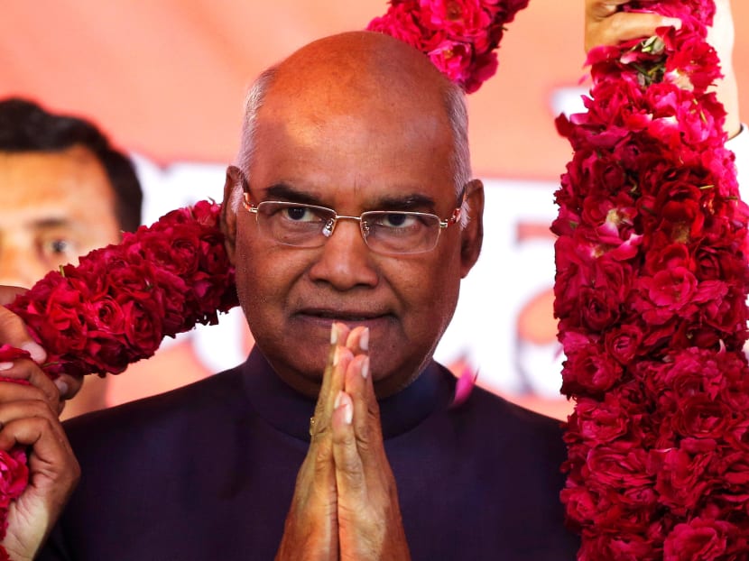 Supporters of Ram Nath Kovind, nominated presidential candidate of India’s ruling Bharatiya Janata Party (BJP), present him with a garland during a welcoming ceremony as part of his nation-wide tour, in Ahmedabad, India, July 15, 2017. Photo: Reuters