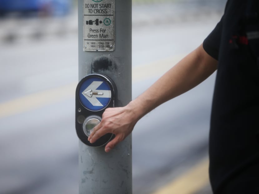 Removing push buttons at road crossings is especially important with the Covid-19 pandemic, as the coronavirus can stay on the buttons for some time, says the writer.